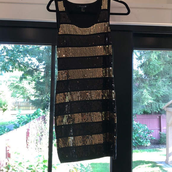 Forever 21 Dresses & Skirts - Gold and black striped dress. Only worn once.